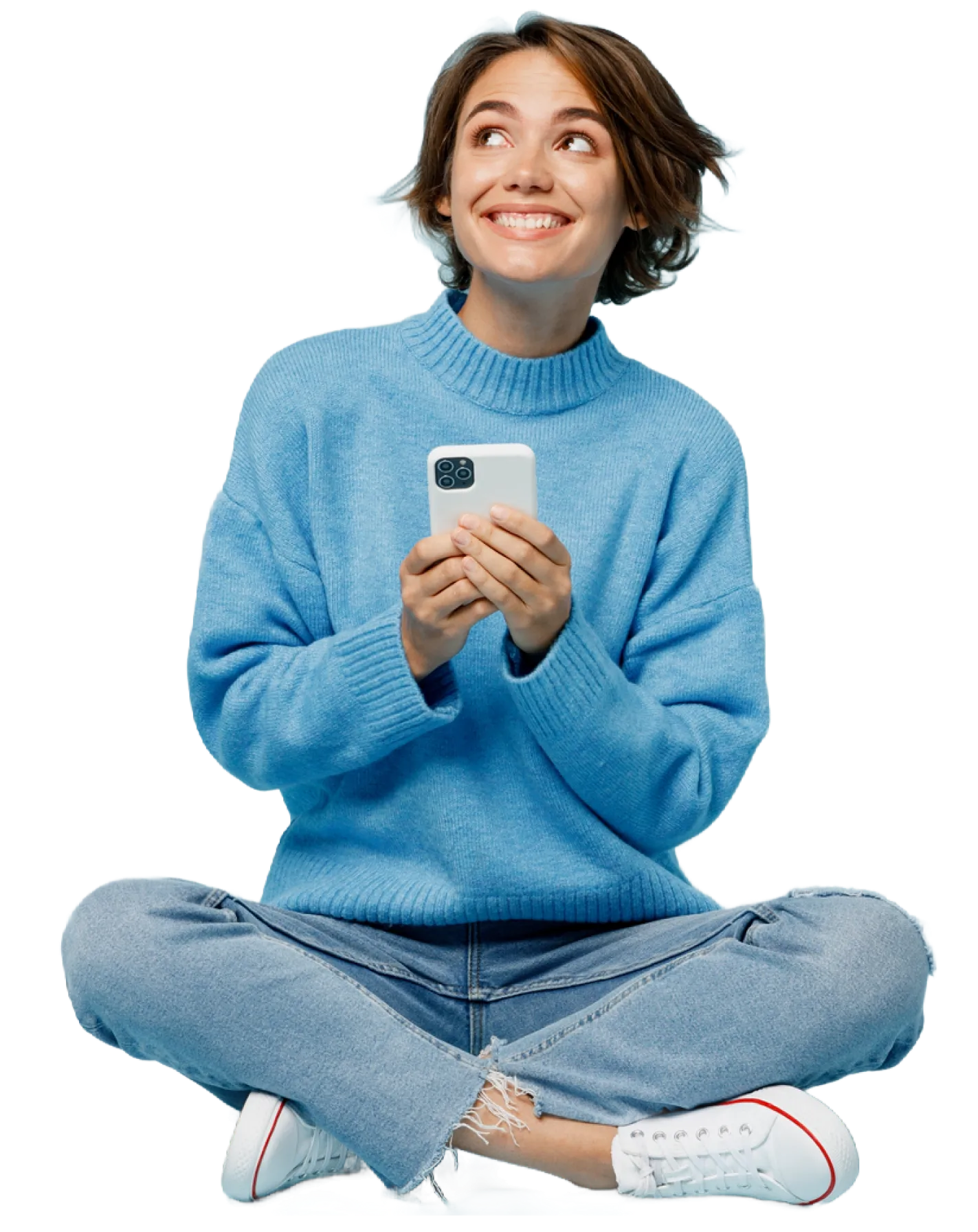 Uma mulher sentada no chão, usando seu telefone.